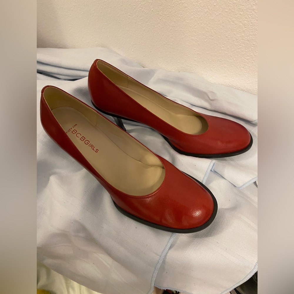 BCBGirls round toe red leather pumps.